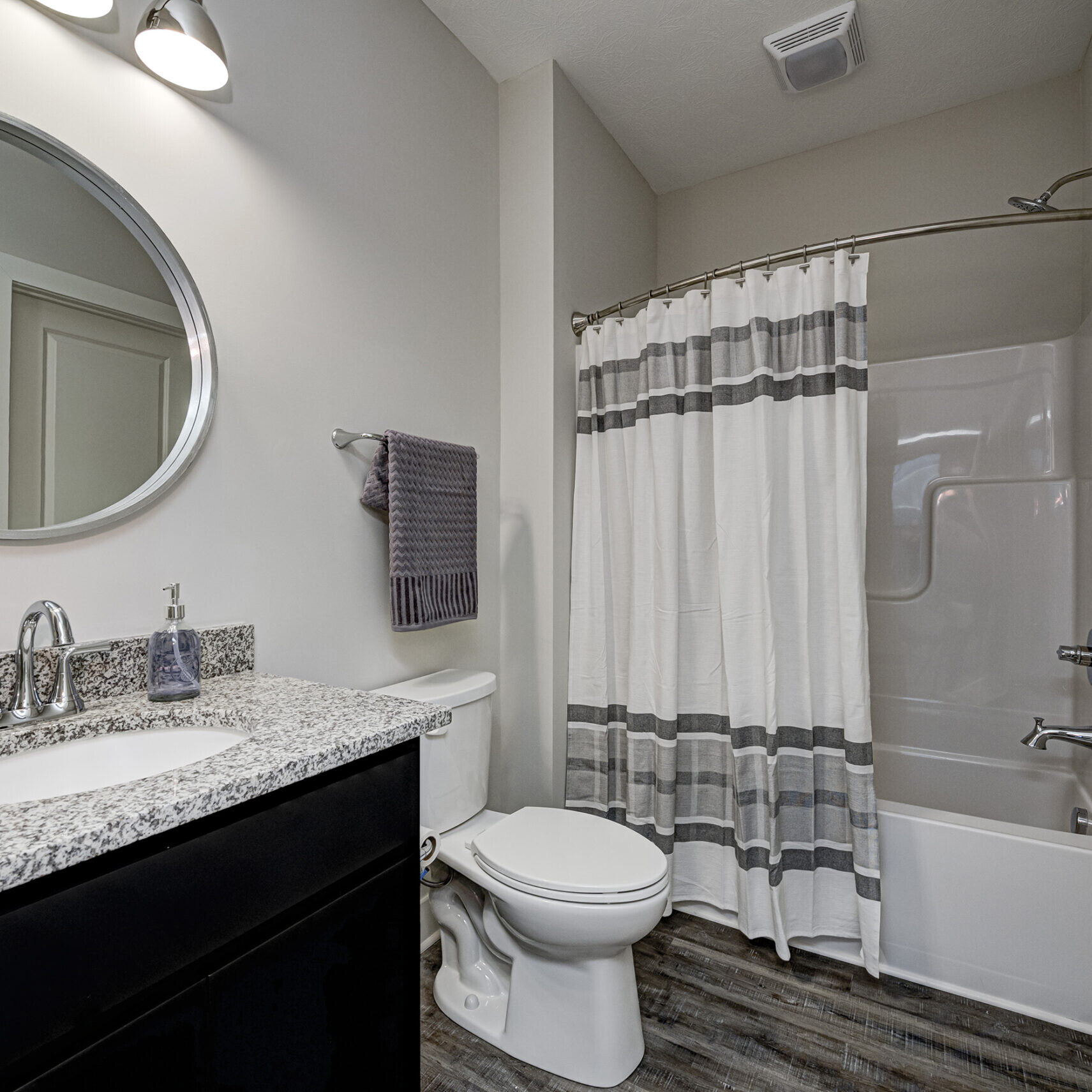 A custom bathroom with a shower, toilet and sink.