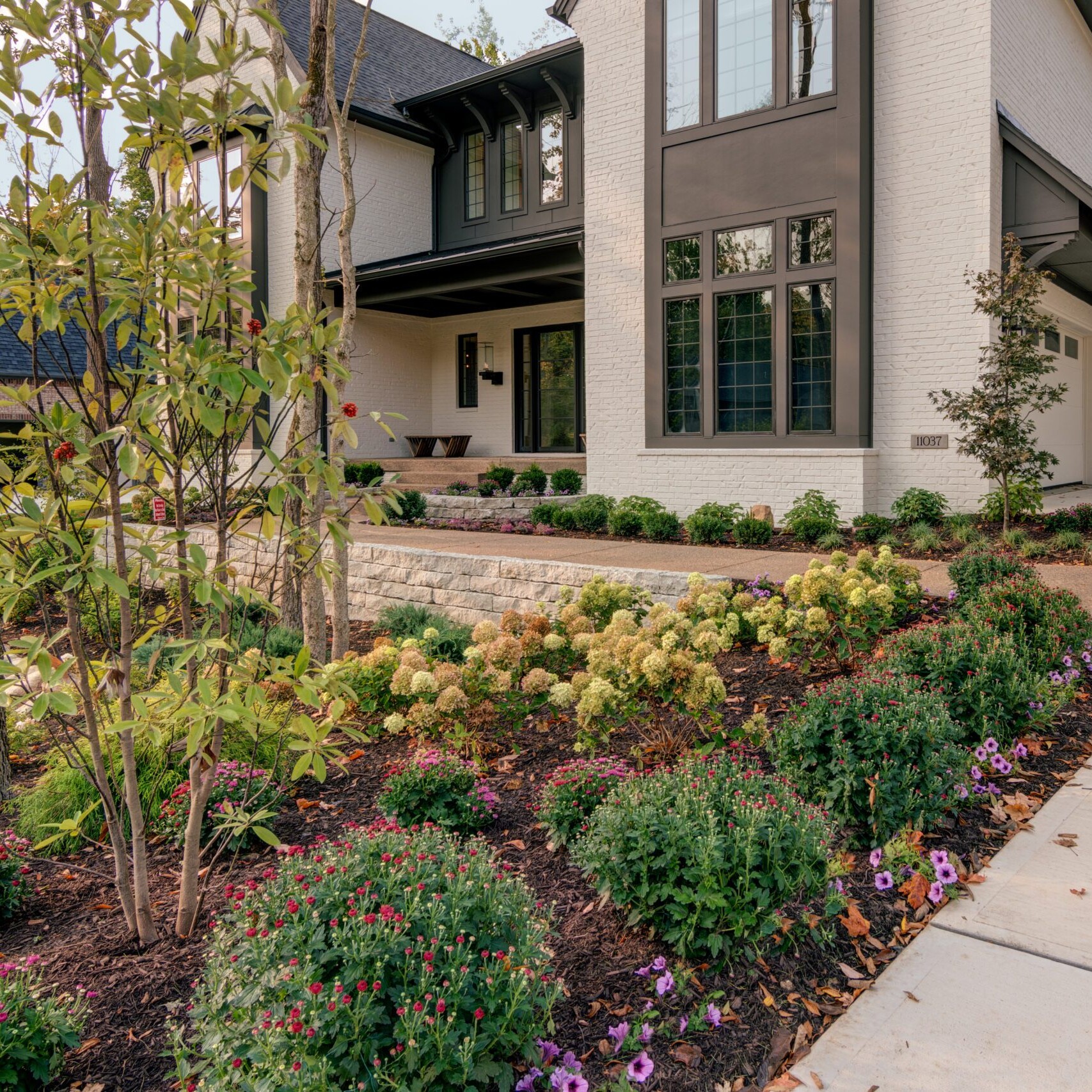 A home with a large front yard and landscaping.