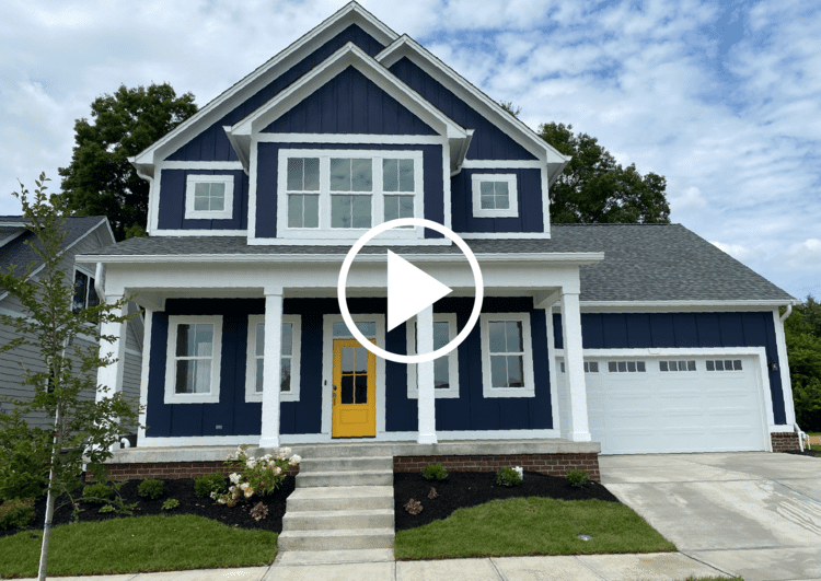 A custom home with a yellow door.